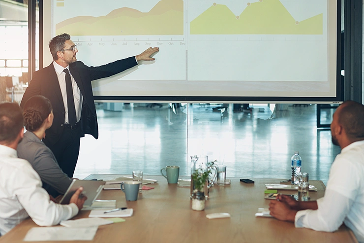 Office worker discussing European high yield bond market analysis 2025 and how to avoid pain points and address challenges.