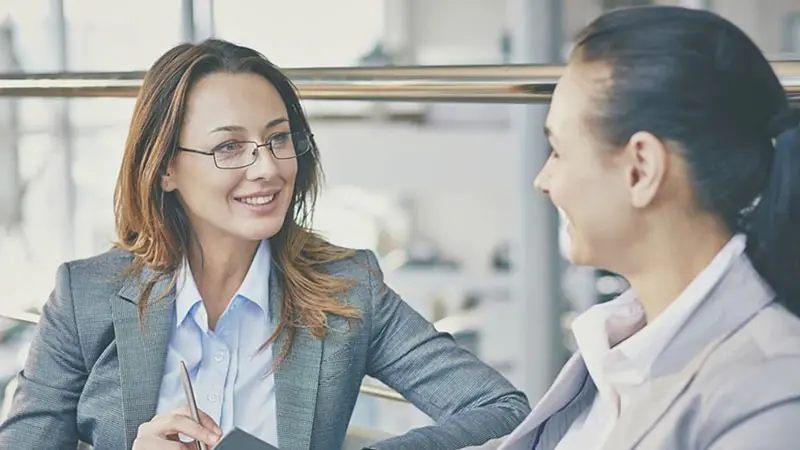 Two businesswomen talking