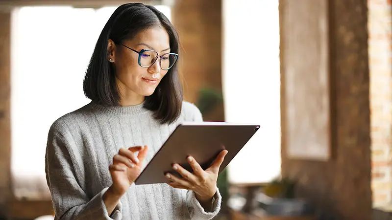 Viewing a webinar on a tablet about payment trends and payment innovations