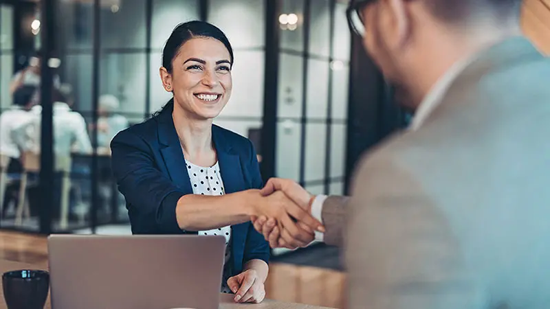 Man shaking hands with his asset custodian after a meeting