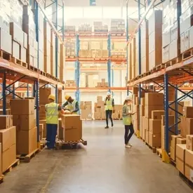 People working at warehouse using a freight management system