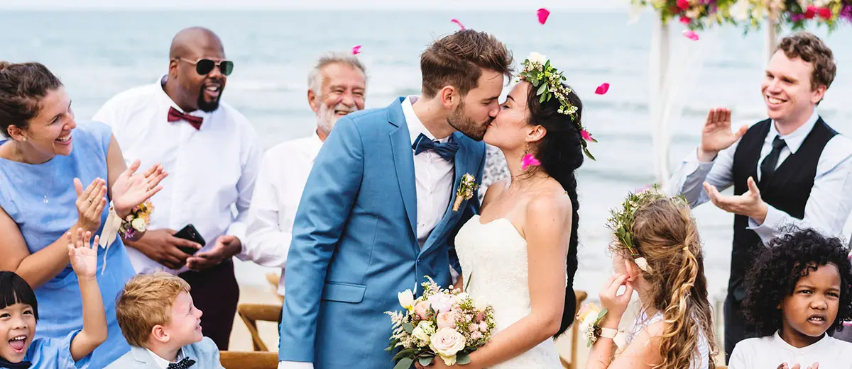 a newly married couple in an outdoor wedding