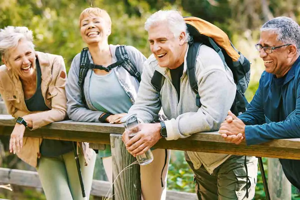 group of senior friends outside laughing