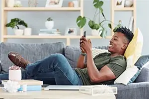 a man at home looking at a phone