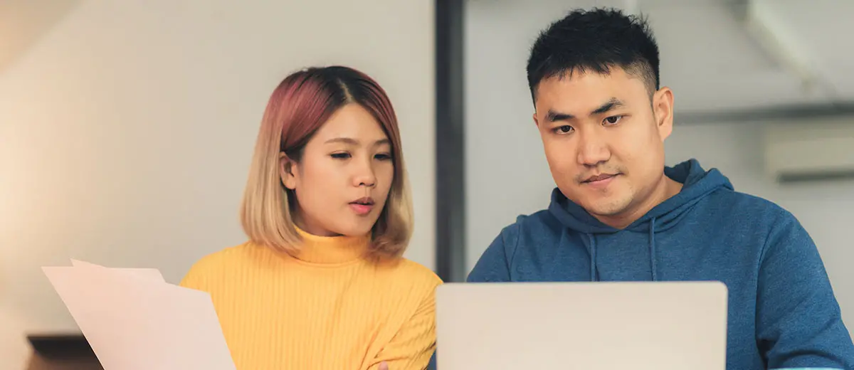 two people looking at documents