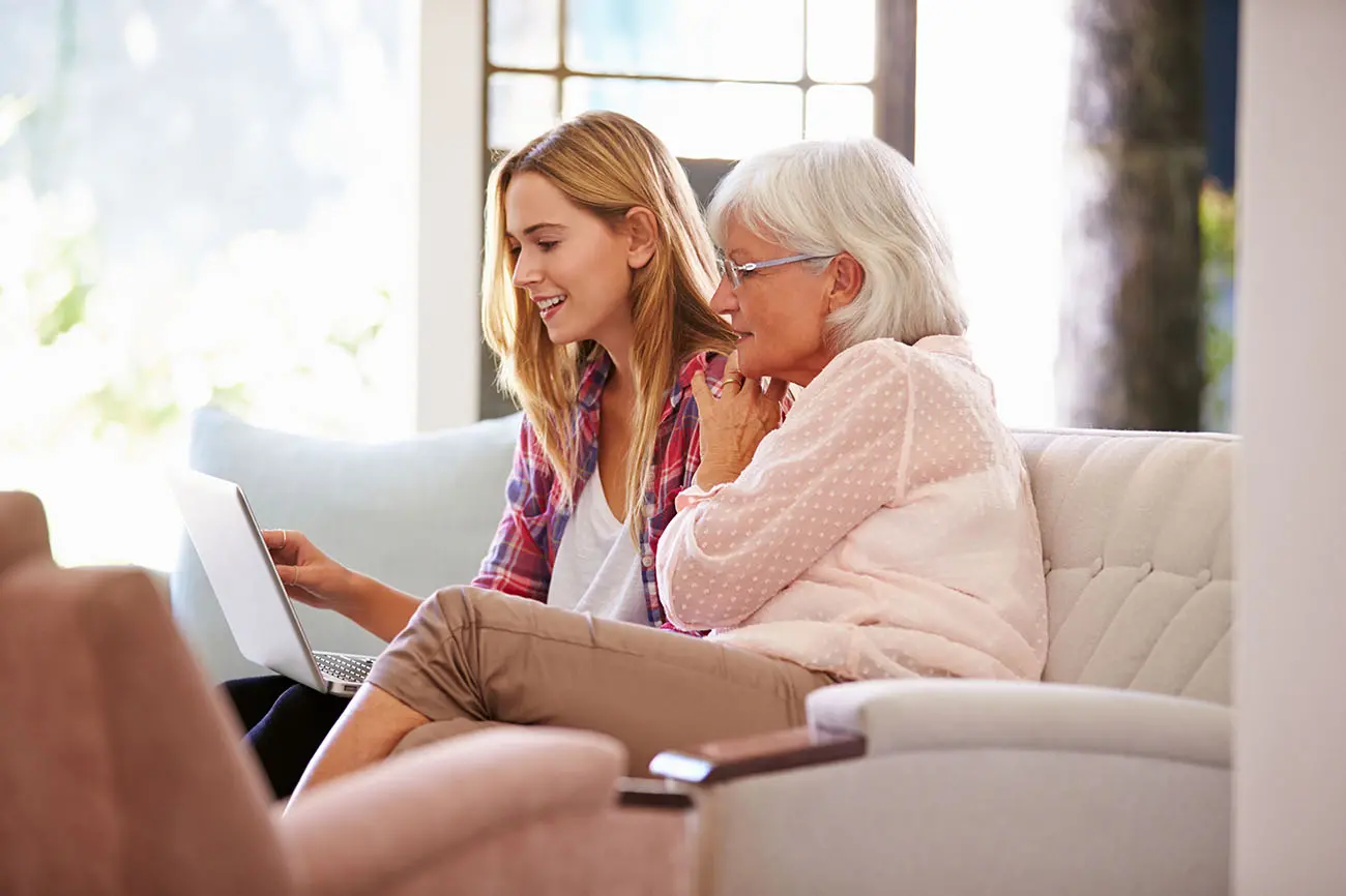 family members reviewing paperwork at home