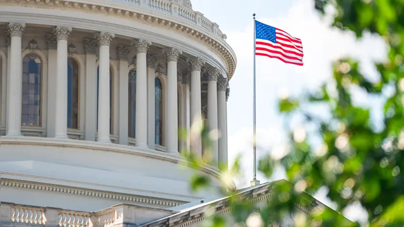 Government building with an American flag waving