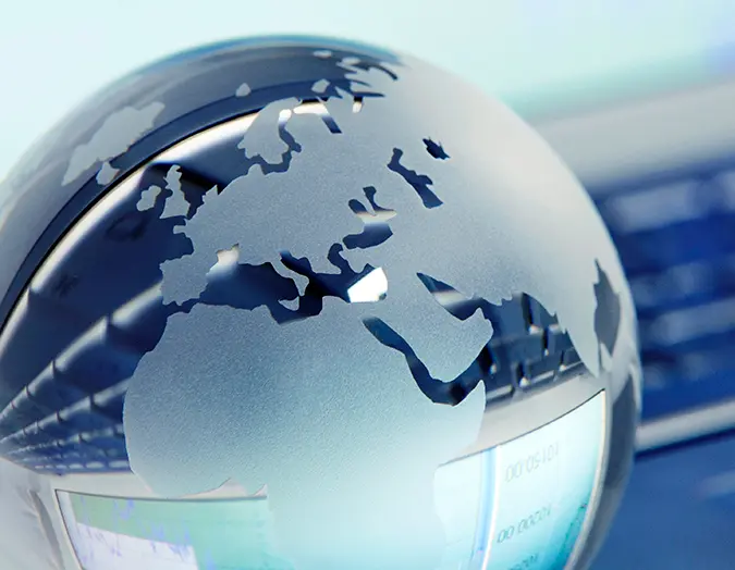 Reflective glass globe tilted toward Europe
