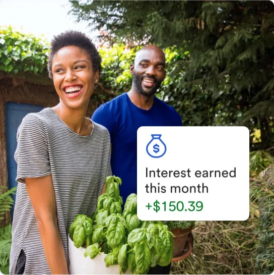 Man and woman smiling in a garden. Text box says Interest earned this month 150 dollars and 39 cents.