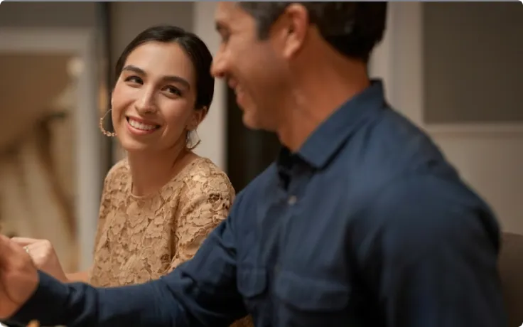 Man and woman smiling at each other