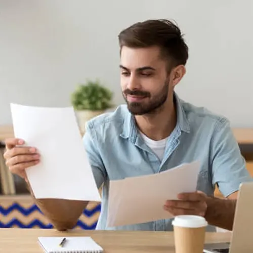 Man reviewing fee information.