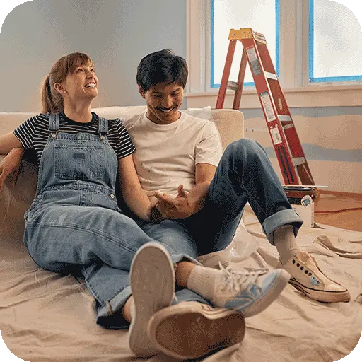 Couple working on a home renovation funded with a high yield savings account