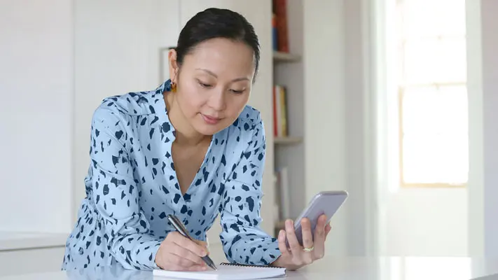 Person balancing checking account online