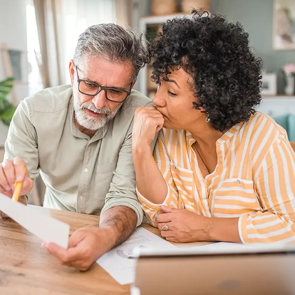 Couple going over finances at the table
