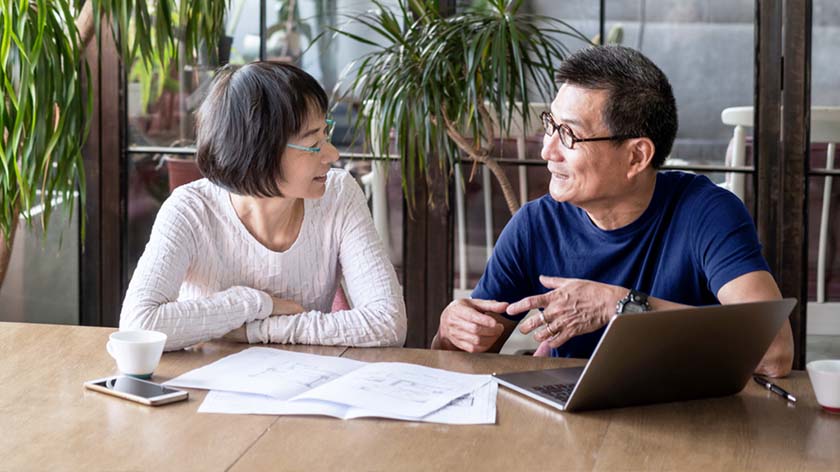 older asian couple discussing wealth planning