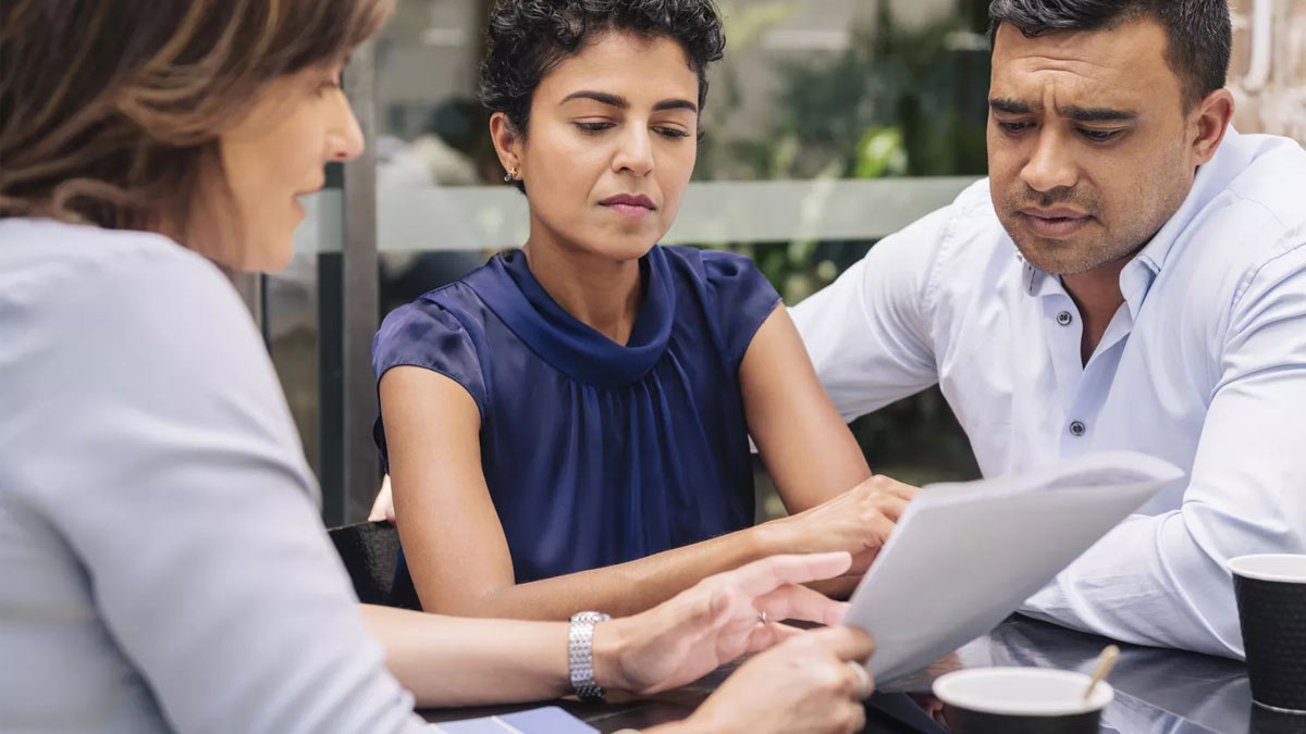 couple reviewing investments with their advisor