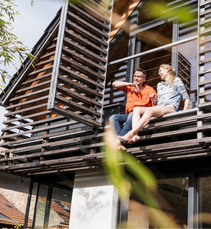 couple sitting on deck discussing finances
