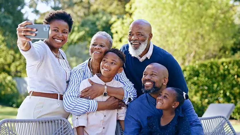 multigenerational family taking a group photo