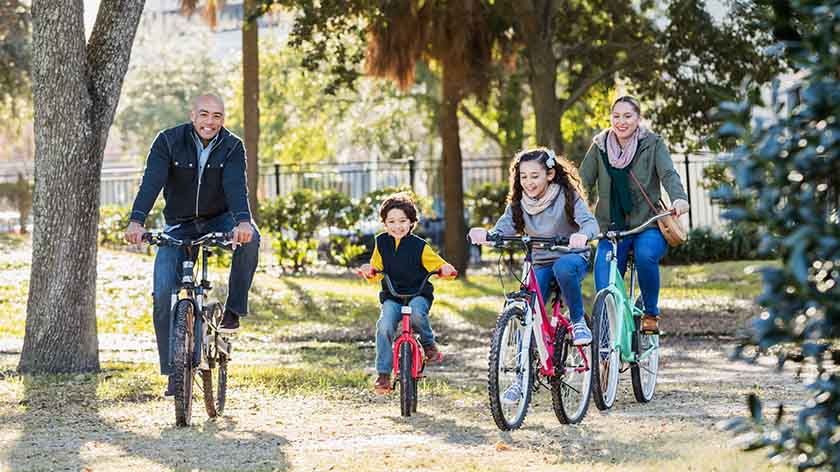 Family riding bikes together