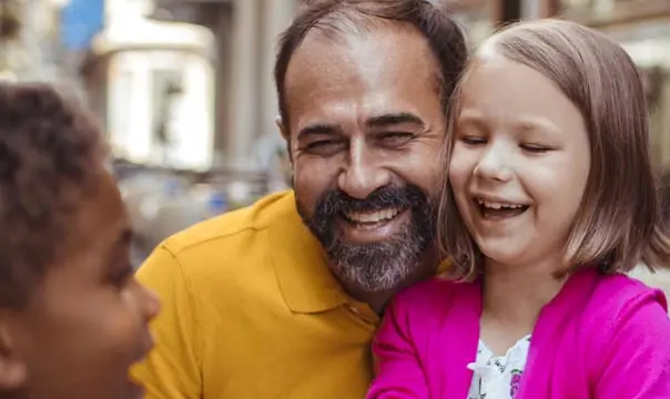 phoot of a family laughing