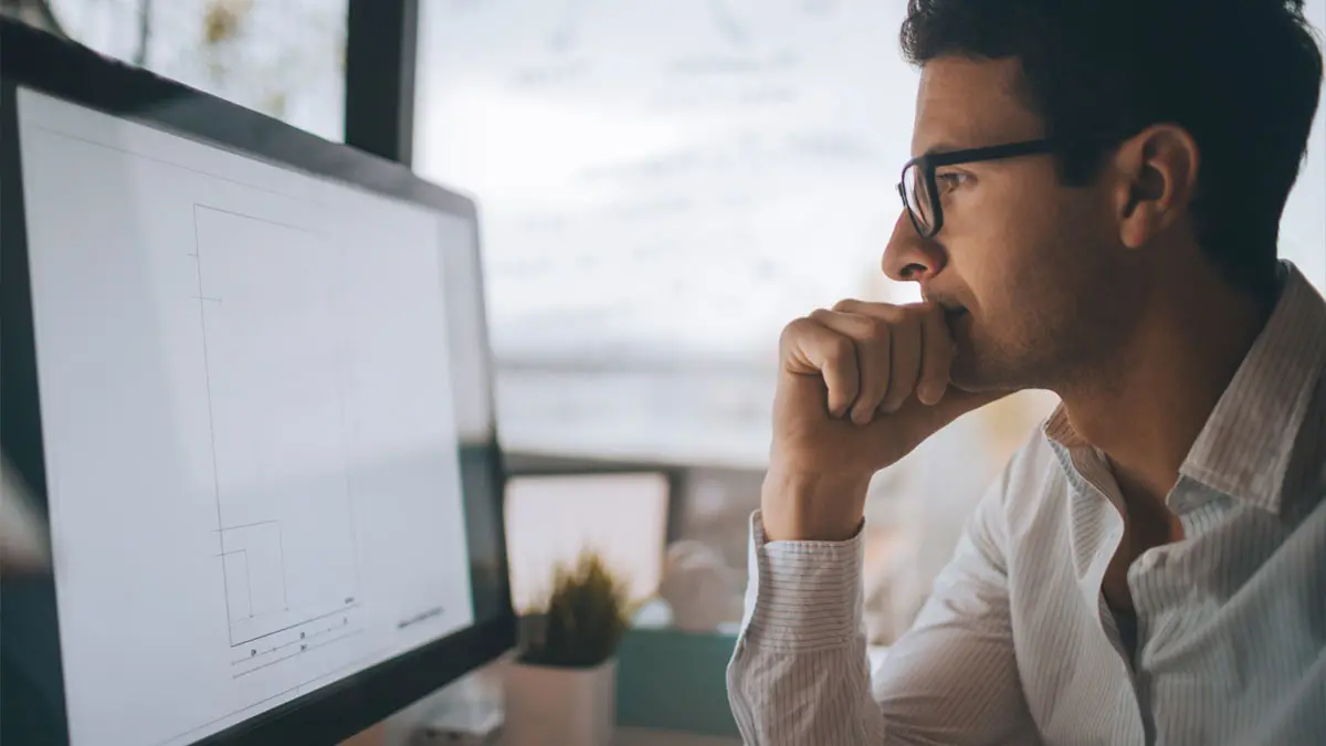 man looking at computer screen