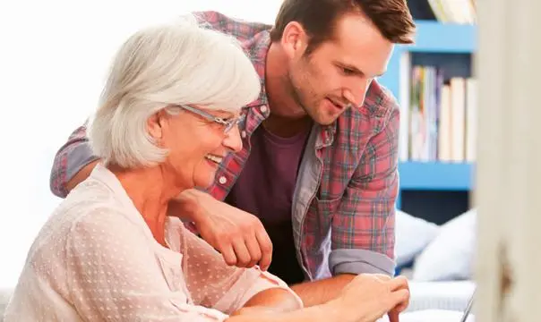mother and son looking at laptop