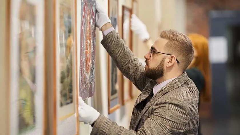 Man working in art gallery