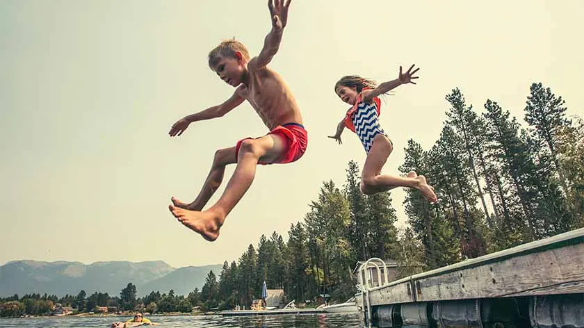 Kids jumping off the dock