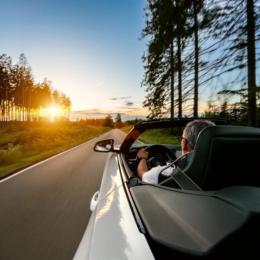 photo of man driving