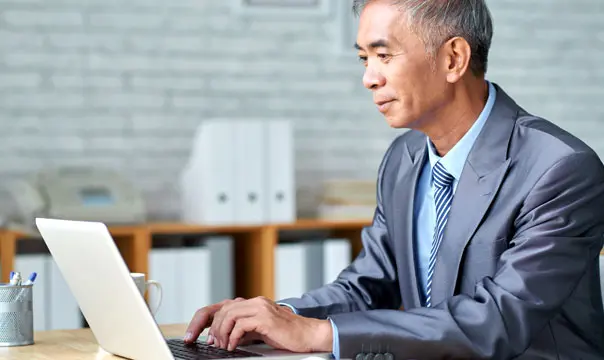 Businessman looking at laptop