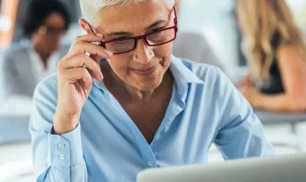Business woman looking at laptop
