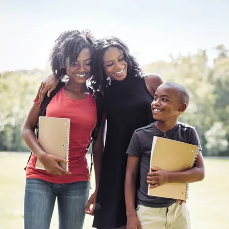 Image of a parent with two kids
