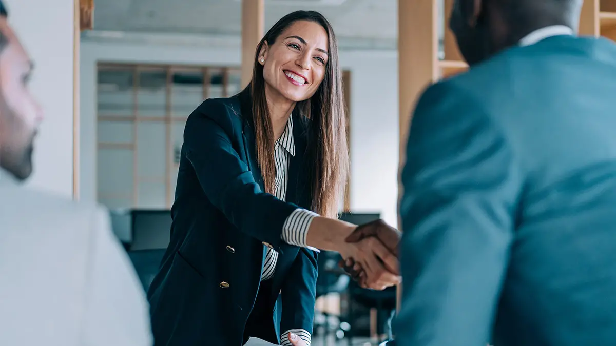 business woman shaking hands with client