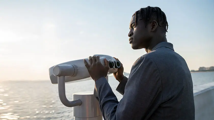 Man looking out over ocean