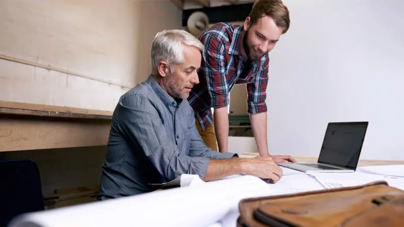 father and son discussing finances