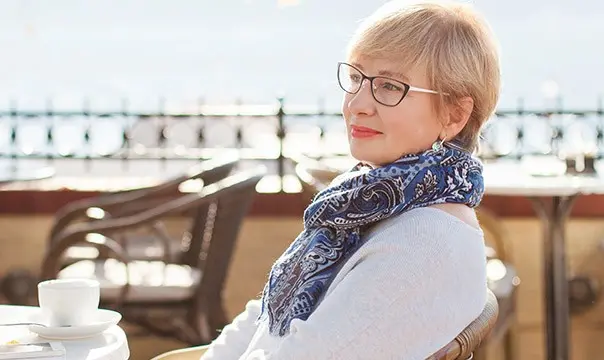 woman having coffe on patio