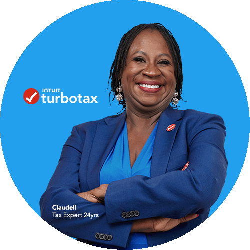 A TurboTax expert with her arms crossed, smiling at the camera