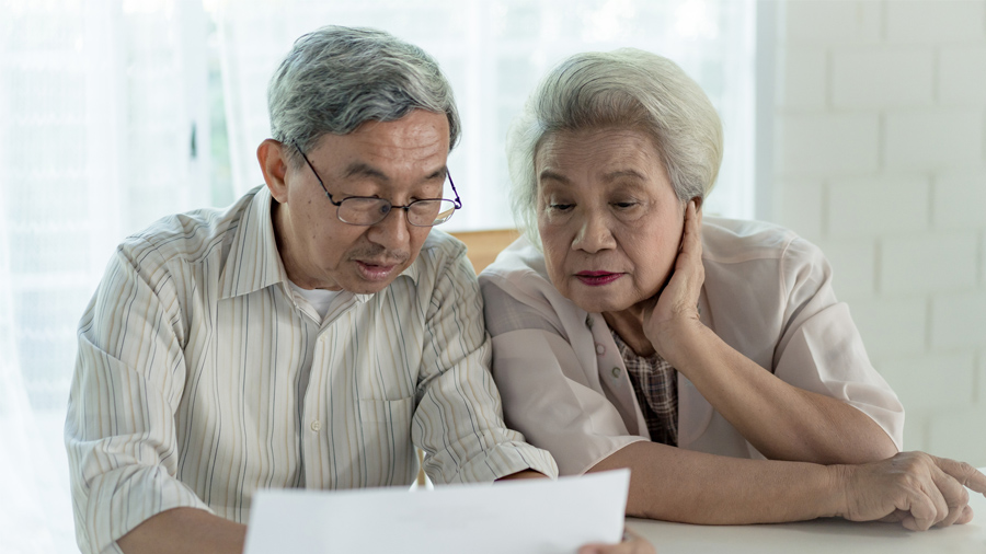 older couple looking at paperwork
