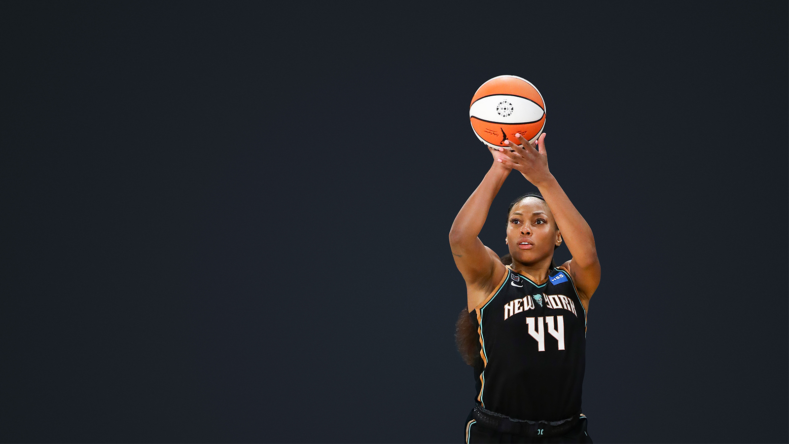 WNBA player shooting a basketball