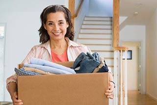 Woman holding a box for moving
