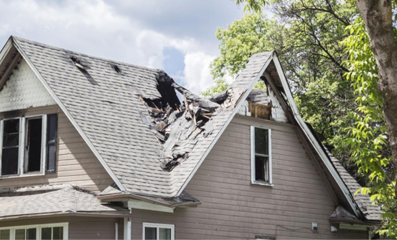 House with severe roof damage