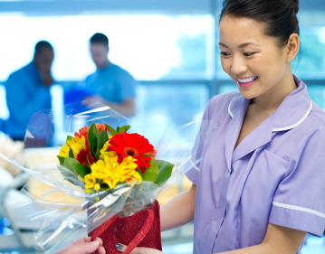 Woman (Nurse) Receiving flowers