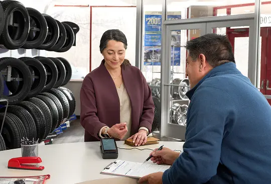 A person buying tires