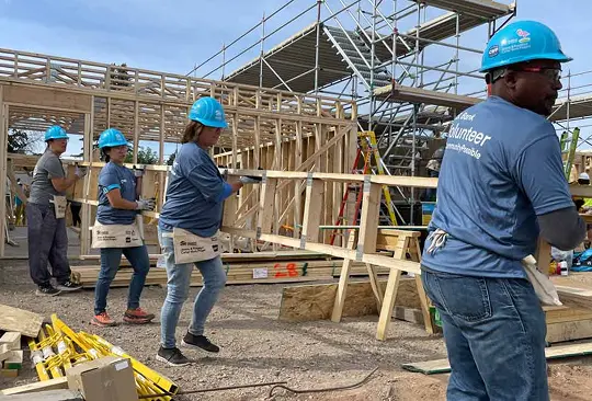 People constructing a new building
