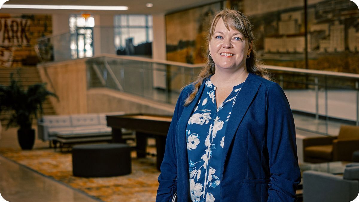 Woman smiling and facing the camera