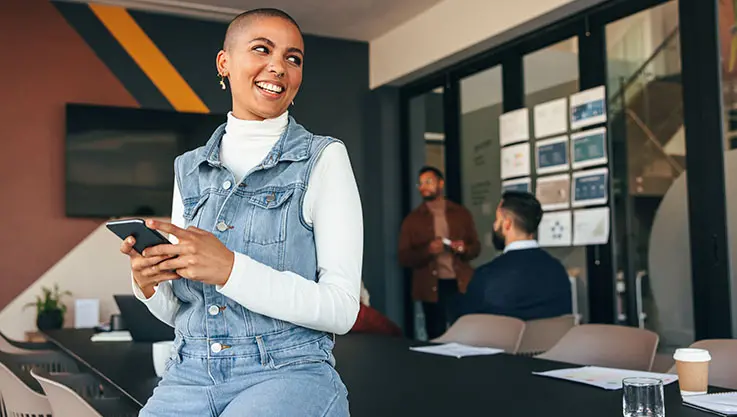 Person holding a mobile device and tapping the screen