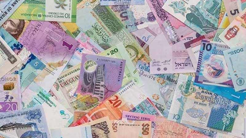 Photo of dozens of international paper currencies