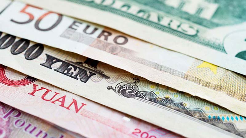 Image of different types of international currency spread out