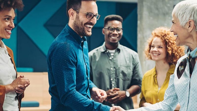 Man shaking hands with a collegue