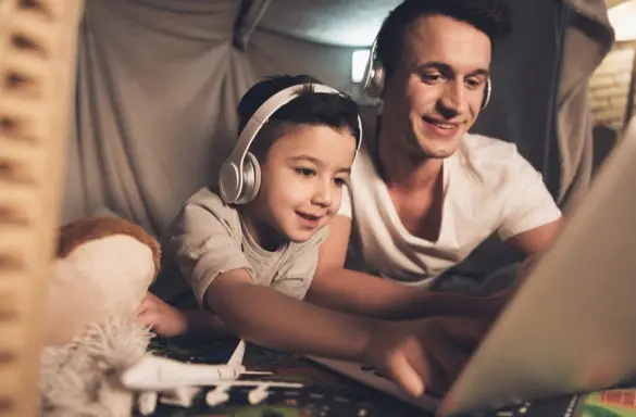 Father and son watch video together